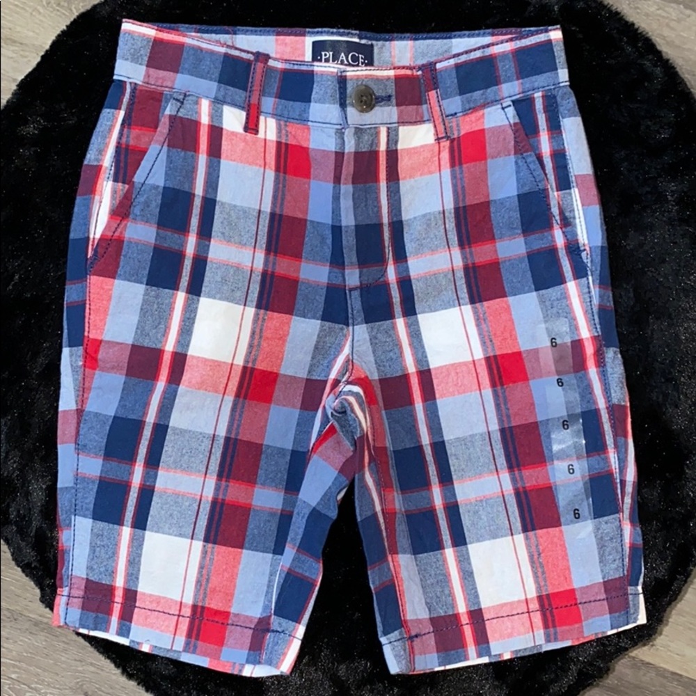Place- plaid shorts. Never worn.